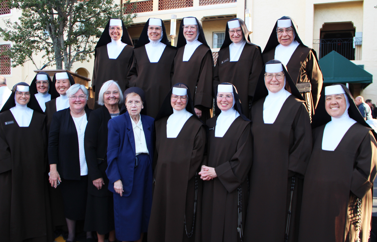 Two religious communities that have been instrumental throughout the evolution of St. Theresa Catholic School in Coral Gables—the Sisters of St. Joseph of St. Augustine and the Carmelite Sisters of the Most Sacred Heart of Los Angeles—are pictured in this group photo taken after the school’s 100th anniversary Mass Nov. 16, 2025, in Coral Gables.