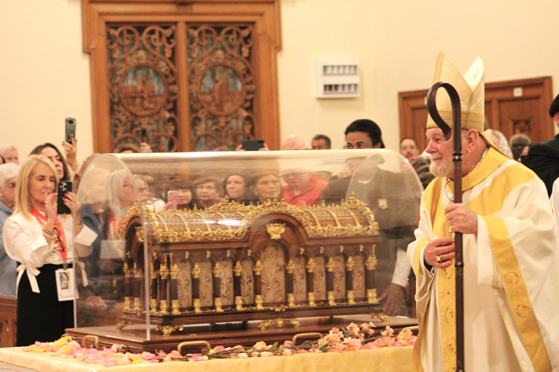 Archbishop Thomas Wenski processes by the relics of St. Therese of Lisieux, at a Mass celebrated at Church of the Little Flower in Coral Gables Dec. 2, 2025.