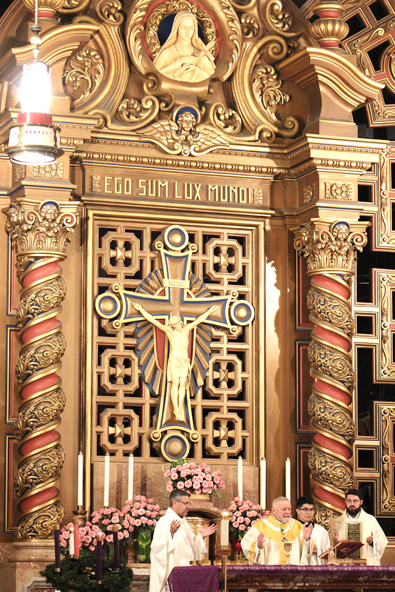 A view of the recently renovated altar at the Church of the Little Flower in Coral Gables is seen at a Mass celebrated by Archbishop Thomas Wenski on Dec. 2, 2025, in honor of the visit of the relics of St. Therese of Lisieux. Accompanying the archbishop, from left, are Father Manny Alvarez, pastor of the church; Father Agustin Estrada, priest-secretary to the archbishop; and Father David Zallocco, parochial vicar of the church.