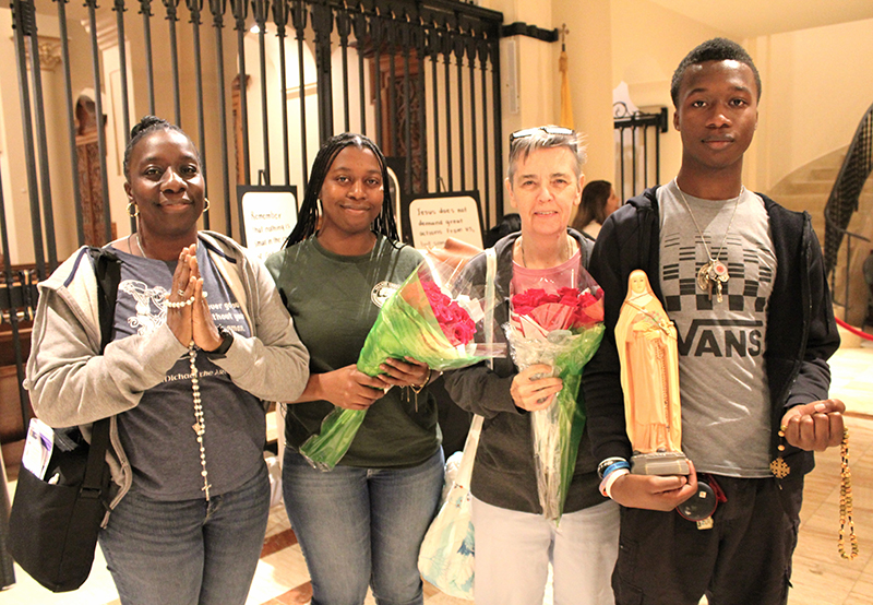Jacqueline Harris (left), along with her children Jessica and Justin, and accompanied by Kathy Regan, drove from Port St. Lucie, Florida, to visit the relics of St. Therese of Lisieux, “The Little Flower,” at the Church of the Little Flower in Coral Gables Dec. 2, 2025.