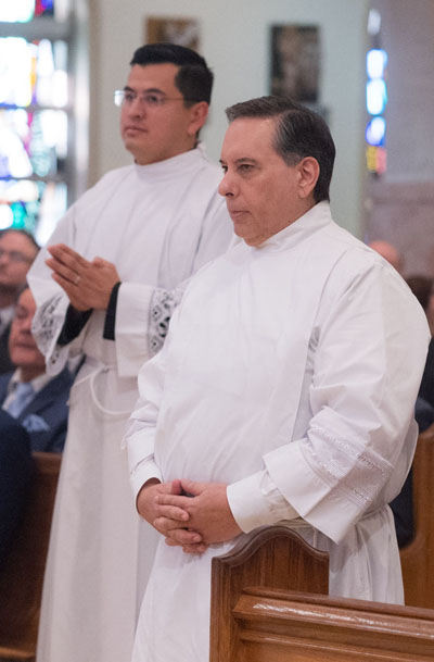 Candidates for the diaconate are called to stand up during the Mass for ordination celebrated on Dec. 13, 2025 at St. Mary Cathedral. Standing from left are Christian David Mendieta and Ramon Carlos Palacio.