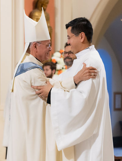 Bishop Silvio Jose Báez Ortega embraces Christian David Mendieta during his diaconate ordination which took place at St. Mary Cathedral, Miami, on Dec. 13, 2025. Both men are exiles of Nicaragua.