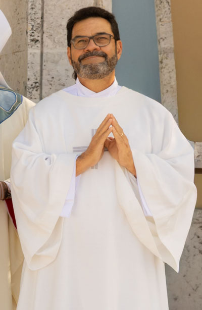 Newly ordained Deacon Gustavo Adolfo Roversi poses for a photo following the Mass of Ordination Dec. 13, 2025, at St. Mary Cathedral, Miami.