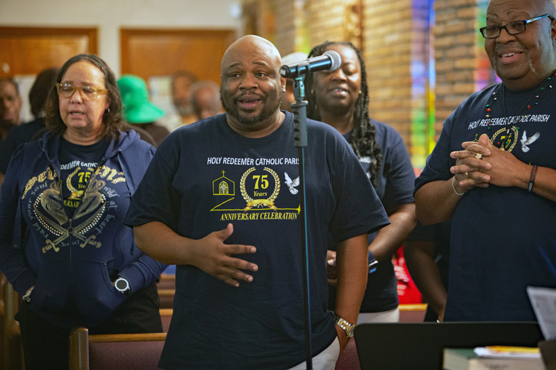 Robert Brown (center) sings with the choir during the 75th anniversary Mass of Holy Redeemer Church in Miami celebrated by Archbishop Thomas Wenski on Dec. 14, 2025. On the occasion, Father Emmanuel Essiet was installed as pastor.