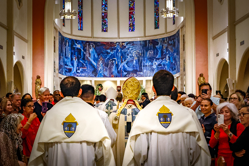 Archbishop Thomas Wenski, center, along with archdiocesan clergy, processes into St. Mary Cathedral to begin the closing Mass of the 2025 Jubilee Year Dec. 27, 2025.