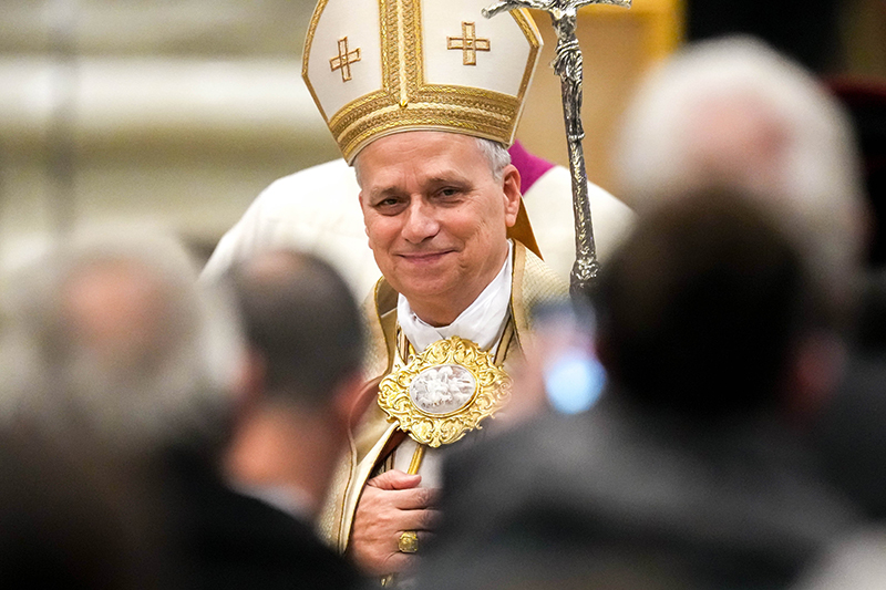 Pope Leo XIV smiles as he leaves after presiding over an evening prayer service at the Basilica of St. Paul Outside the Walls in Rome Jan. 25, 2026, concluding the Week of Prayer for Christian Unity.