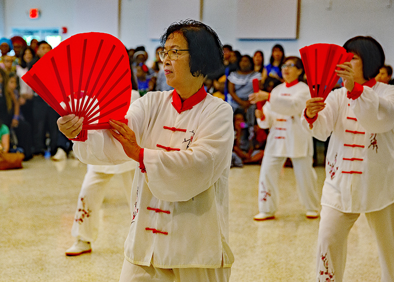 Nancy Liand, and other members member of the Chinese apostolate perform Tai Chi at the gathering that followed the annual Migration Mass, featuring multicultural foods and folkloric dances from the various ethnic groups. Archbishop Thomas Wenski celebrated the Mass Jan. 11, 2026, the feast of the Baptism of the Lord, at St. Mary Cathedral.