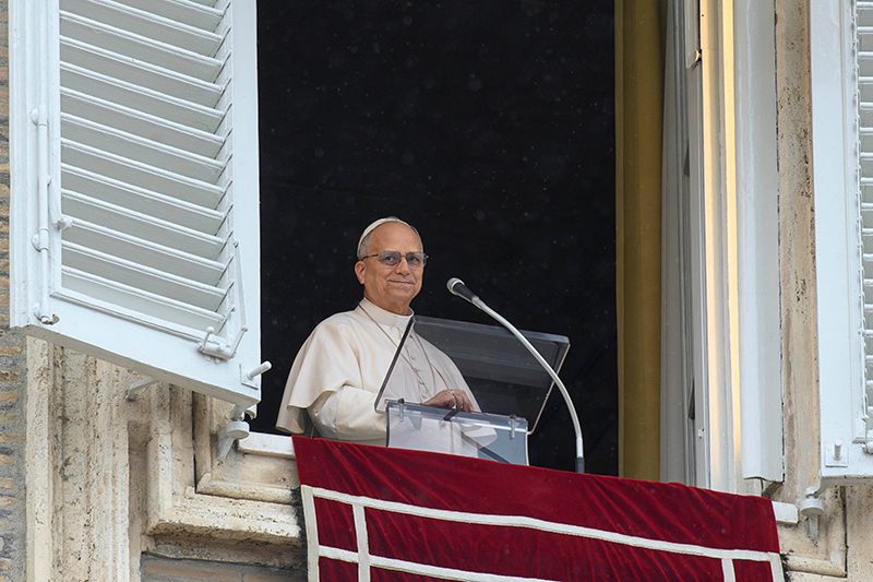 Pope Leo XIV smiles as he leads the Angelus prayer from a window of the Apostolic Palace at the Vatican, March 22, 2026. (OSV News / Vatican Media, Matteo Pernaselci via Reuters)