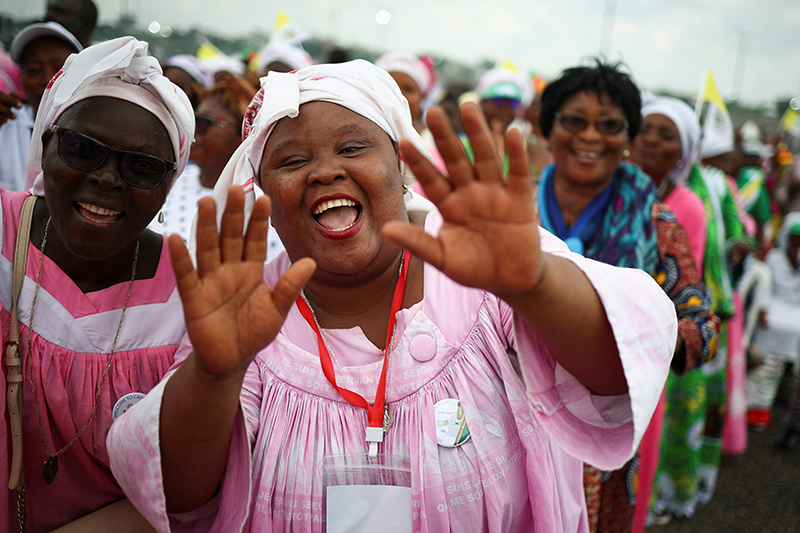 An attendee gestures during a Mass celebrated by Pope Leo XIV near Japoma Stadium in Douala, Cameroon, April 17, 2026. (OSV News photo/Guglielmo Mangiapane, Reuters)