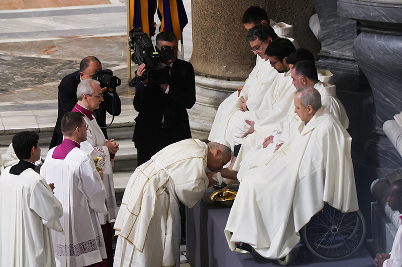 Pope Leo XVI washes the feet of clergymen as he celebrates the Holy Thursday Mass of the Lord's Supper in the Basilica of St. John Lateran at the Vatican April 2, 2026. (OSV News photo/Vincenzo Livieri, Reuters)