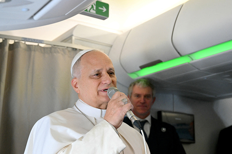 Pope Leo XIV addresses journalists during the flight heading to Algiers on April 13, 2026. Pope Leo embarked on an 11-day apostolic journey to Algeria, Cameroon, Angola and Equatorial Guinea on April 13 for his first major international trip since becoming pontiff in May 2025. (OSV News photo/Alberto Pizzoli, pool via Reuters)
