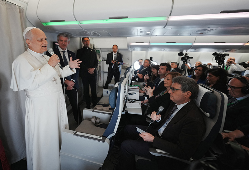 Pope Leo XIV speaks to journalists aboard a flight returning to Rome April 23, 2026, at the conclusion of his 11-day apostolic journey to Africa. (OSV News photo/Andrew Medichini, pool via Reuters)
