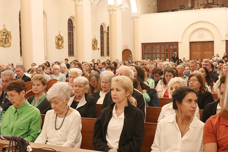 Parishioners of St. Patrick Church pray during the Mass celebrating the 100th anniversary of the church in Miami Beach, March 17, 2026. Archbishop Thomas Wenski was the main celebrant.