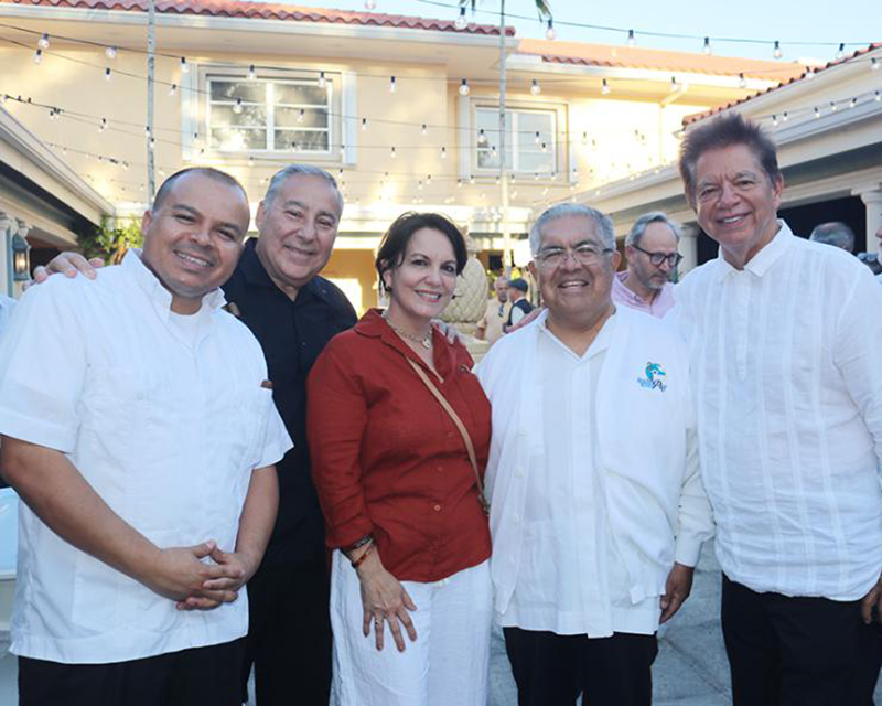 Enjoying Havana Nights are, from left, Father Elvis Gonzalez, pastor of St. Michael the Archangel Church in Miami; Alfredo and Lucy Piña; Msgr. Roberto Garza, director of Radio Paz 830 AM; and Peter Routsis-Arroyo, executive director of Catholic Charities of the Archdiocese of Miami. The annual fundraiser for Catholic Charities' Unaccompanied Minors Program took place March 26, 2026, at St. Mary Cathedral’s courtyard in Miami.