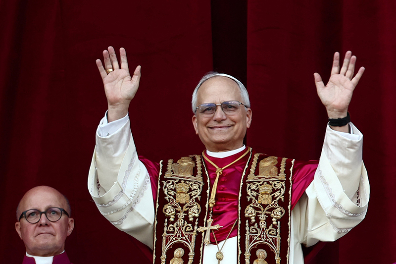 Pope Leo XIV, the former Cardinal Robert F. Prevost, waves to the crowds in St. Peter's Square at the Vatican after his election as pope May 8, 2025. The new pope was born in Chicago. (CNS photo/Lola Gomez)