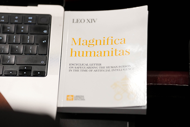A copy of Pope Leo XIV’s first encyclical, “Magnifica Humanitas: On Safeguarding the Human Person in the Time of Artificial Intelligence,” is seen during a presentation on the document at the Vatican May 25, 2026. (CNS photo/Lola Gomez)