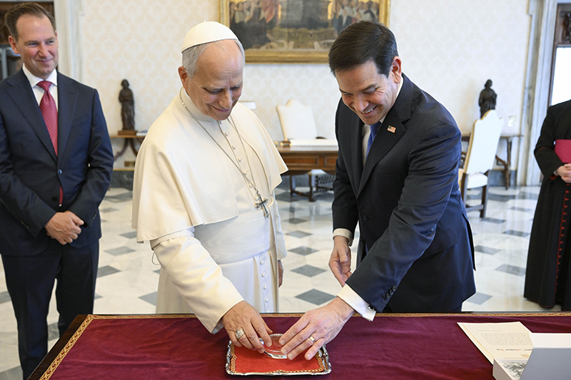 Pope Leo XIV exchanges gifts with U.S. Secretary of State Marco Rubio during a private audience at the Vatican May 7, 2026. (OSV News photo/Matteo Pernaselci, Vatican Media)