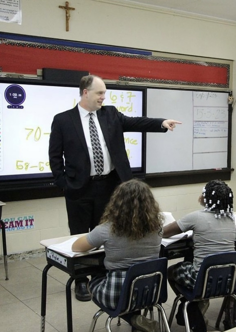 Dr. Jim Rigg, Cabinet Secretary of Education and Superintendent of Schools for the Archdiocese of Miami, speaks to students during a visit to a Catholic school.