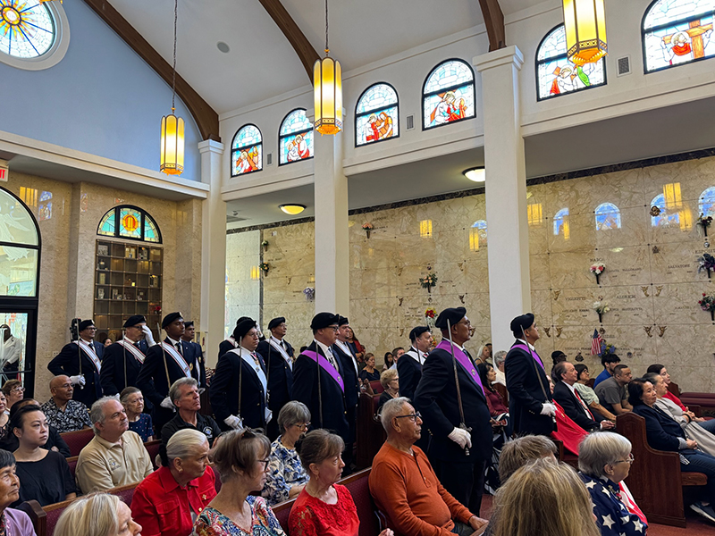 Members of a color guard process into the annual Memorial Day Mass celebrated by Archbishop Thomas Wenski at Our Lady Queen of Heaven Cemetery in North Lauderdale May 25, 2026.