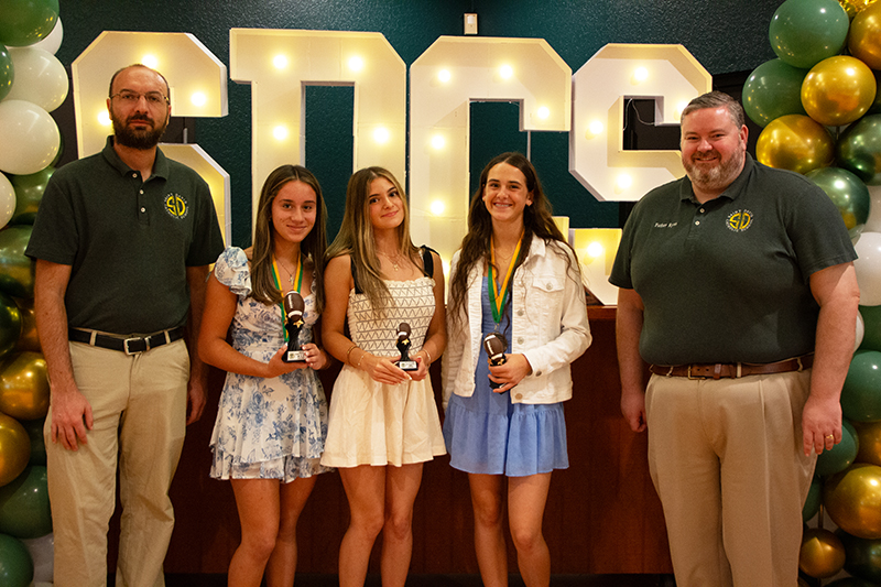 St. David School student athletes belonging to the girls flag football team pose with their awards during St. David School’s inaugural sports awards ceremony May 29, 2026 at St. David’s parish hall in Davie. The girls flag football team achieved second place in the diocese this past season.