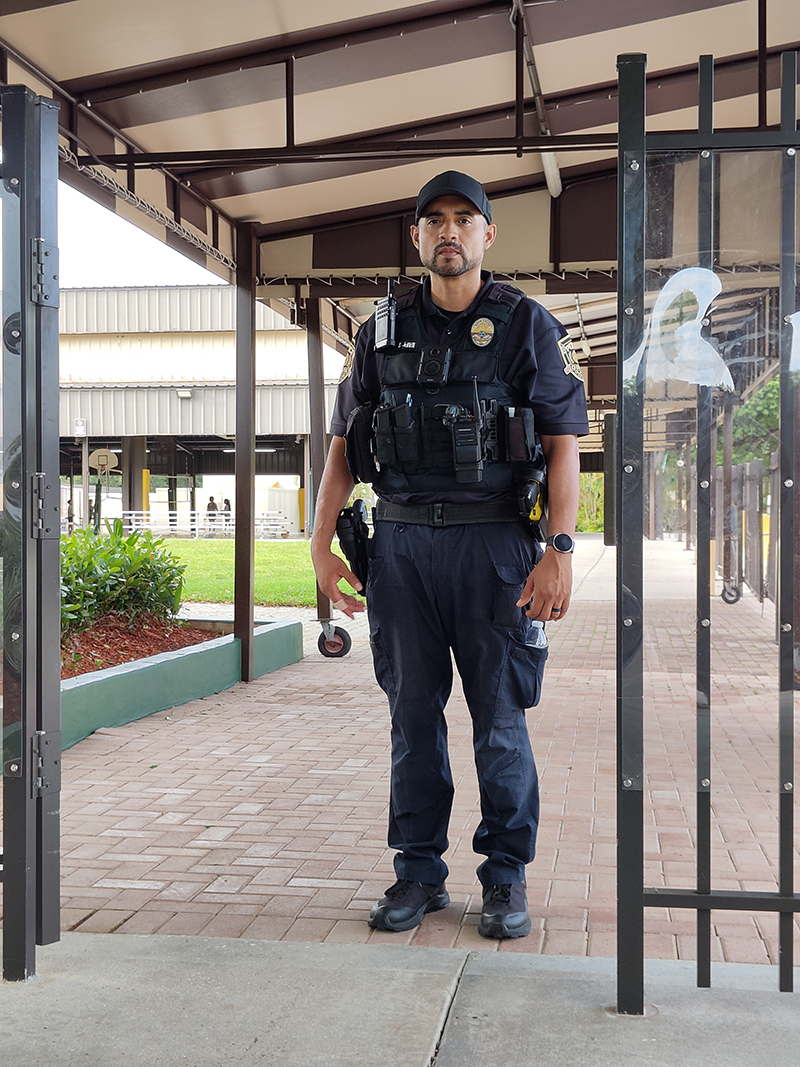 A Davie police officer patrols the campus of St. David Catholic School. School officials say the visible presence of law enforcement is a key component of their campus security strategy and provides an immediate response capability when needed.