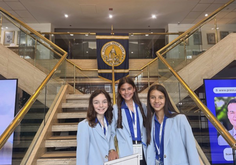 Adriana Icaza, Sam Dominguez and Clementina Martinez-Christensen from St. Thomas the Apostle School in Miami pose at the National Press Club in Washington, D.C. as part of the 2026 Toshiba/NSTA ExploraVision Competition. In the largest K-12 science competition in the world, the girls won second place in the Grade 4-6 category for their “Smart Sock” invention idea and were interviewed at the National Press Club June 5, 2026.