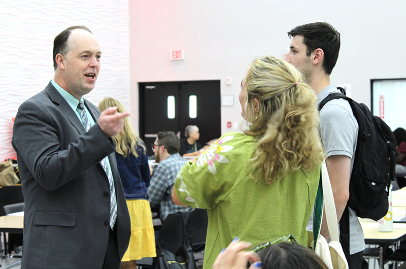 Dr. Jim Rigg, superintendent of Catholic schools for the Archdiocese of Miami, speaks to two teachers at the New Teacher Orientation hosted Aug. 4, 2026 at Monsignor Edward Pace High, in Miami Gardens. Nearly 250 new Archdiocese of Miami educators participated in the half-day event organized by the Office of Catholic Schools.