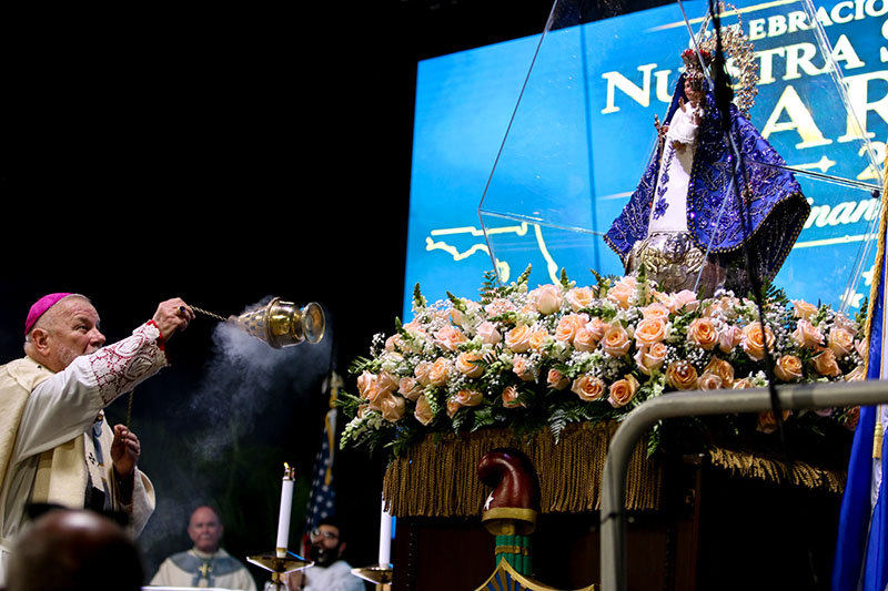 Archbishop Thomas Wenski of Miami incenses the statue of Our Lady of Charity, a symbol of Mary’s enduring love, during the annual Our Lady of Charity feast day Mass Sept. 8, 2026, held at Miami-Dade Fair and Exposition.