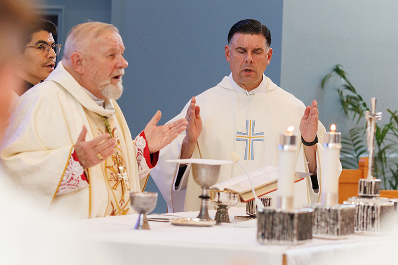 Father Raphael Capó , newly commissioned interim president of St. Thomas University in Miami, stands alongside Miami Archbishop Thomas Wenski during a Sept 22 Mass on the Feast of St. Thomas of Villanova. Archbishop Wenski presided at the Mass along with Father Capó’s commissioning and reaffirmation of the university mission.