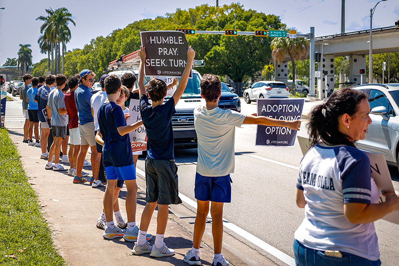 Belen Jesuit Preparatory School students advocate for respect for human dignity during the annual Miami Life Chain display across US 1 on Respect Life Sunday, Oct. 4, 2026.