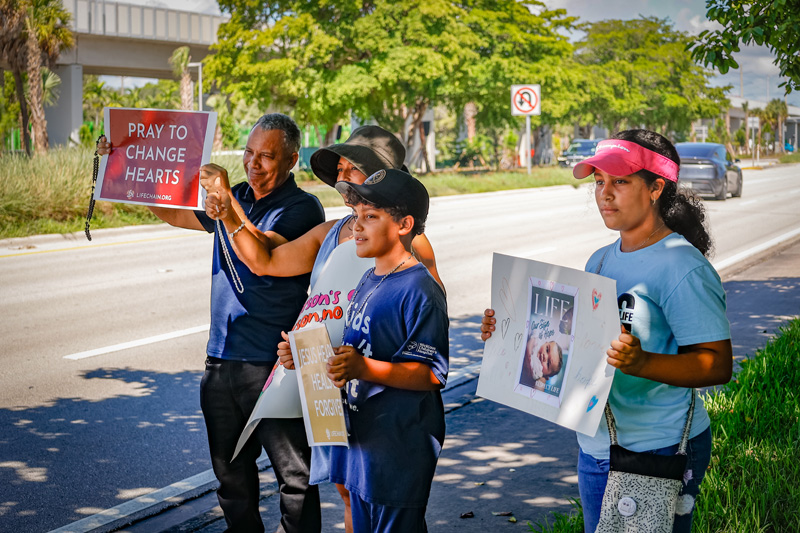 Families from the ARCH Angels of South Florida Catholic homeschool community advocate for respect for human dignity during the annual Miami Life Chain display across US 1 on Respect Life Sunday, Oct. 4, 2026.