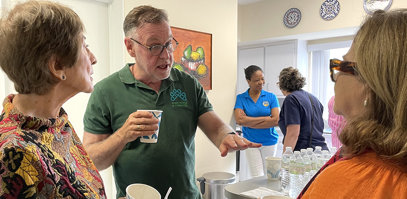 Randy McGrorty, executive director of Catholic Legal Services, speaks with Patricia Stockton, a member of the Teresian Association, during an Oct. 18 gathering at the Poveda Center in Miami focused on immigration challenges and ways volunteers can support immigrant families.