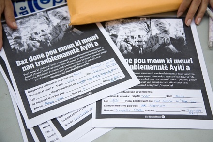 A flyer at Notre Dame d'Haiti Mission in Miami announces The Miami Herald's Haiti Memorial Database project.
