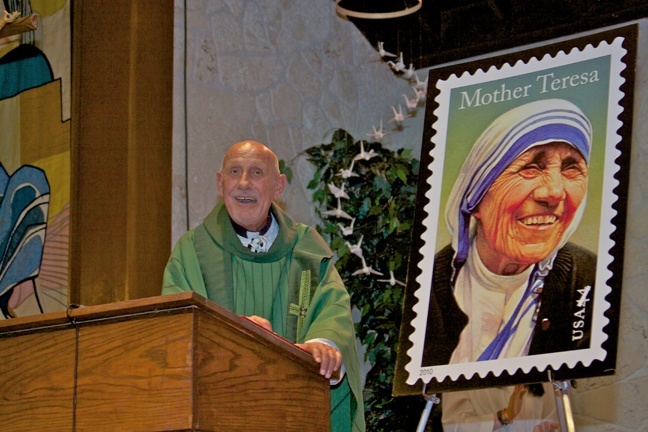 Father Roger Holoubek, pastor, speaks about Mother Teresa to parishioners at St. Maurice Church.