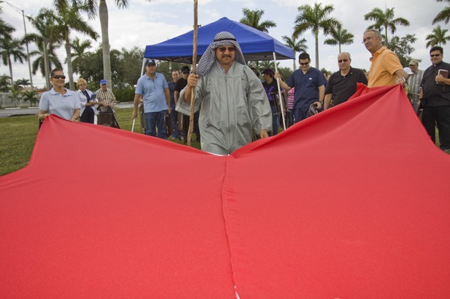 Roberto Vargas, playing Moses, parts the waters of the Red Sea.