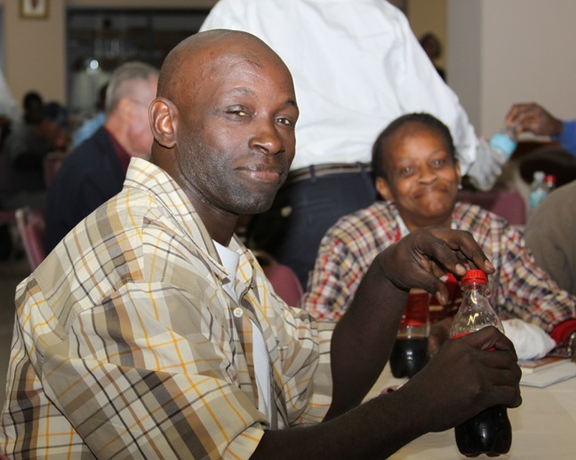 Sebastian Oliver, a former client and now volunteer, enjoys the reception that followed Camillus House's 50th anniversary Mass Jan. 19. “When I was down and out they took me in, guided me in the right direction," he said.