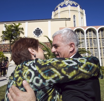 Maria Rodriguez Blanco, a parishioner of St. John Neumann Church in Kendall, hugs fellow parishioner and newly-ordained permanent deacon Joseph Maalouf after the ceremony.