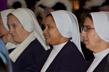 Religious Sisters Ana Maria, Rosmery and Yolanda of the Siervas de Jesus participate in the Mass in honor of the Immaculate Conception.
