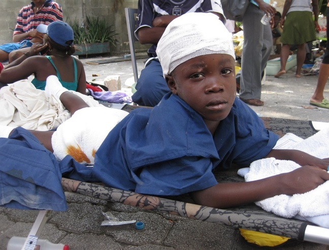A child injured by the Jan. 12 earthquake lies on a stretcher after receiving  medical attention in one of the makeshift hospitals that now dot Port-au-Prince.