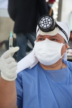 Sister Bertha Lopez Chavez, a nurse with Caritas Mexico, works in a makeshift hosptial near the Haitian cathedral in the days following the devestating earthquake.