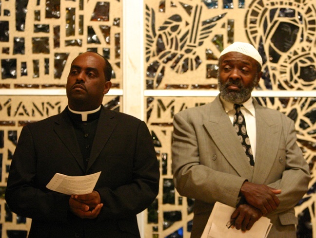 Father Reginald Jean-Mary, pastor of Notre Dame d'Haiti, and Imam Fred Nuriddin of the Masjid Al-Ansar, were among more than a dozen religious leaders who gathered at Notre Dame d'Haiti Feb. 3.