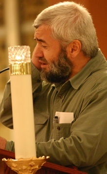 Imam Ismet Akcan reads from the Qur'an during the interfaith prayer service for Haiti.