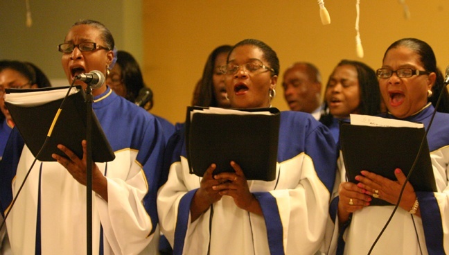 Notre Dame d'Haiti's choir members sing "Amazing Grace" at the end of the interfaith prayer service for Haiti.
