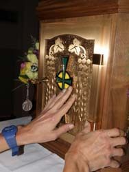 Nigel Ricards touches the tabernacle during the explanation of Mass for the blind and visually impaired that took place at St. Gabriel in February. The event was organized by Dolores McDiarmid, a local Catholic with a master's degree in pastoral ministries who has worked with the blind and visually impaired for more than 25 years.