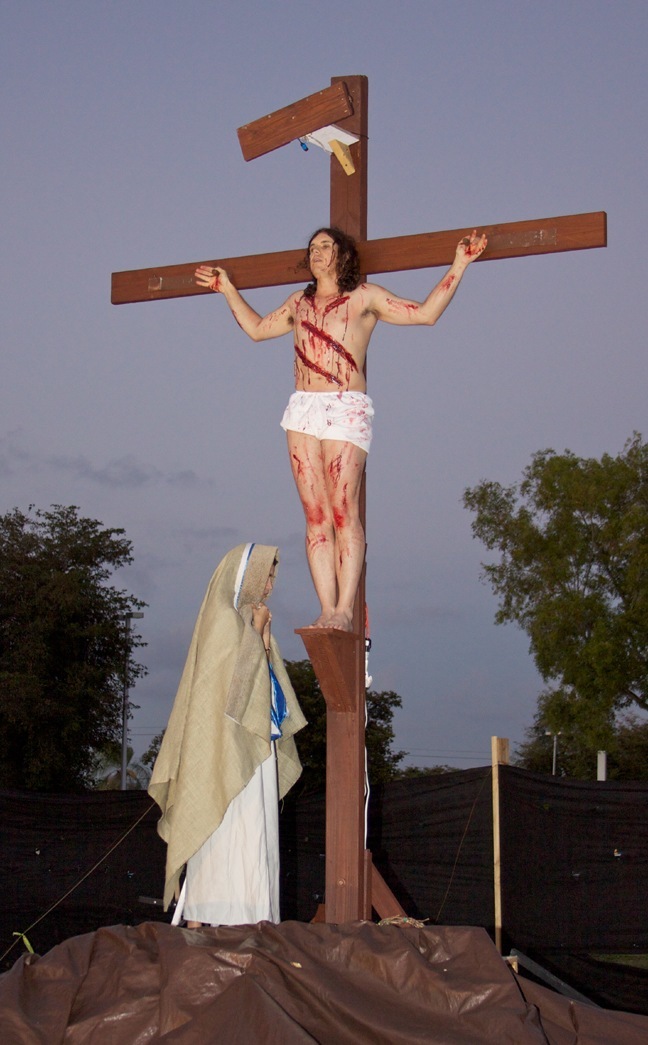 Mary stands at the feet of the crucified Jesus in this scene from the passion of Christ put on by St. Vincent Parish in Margate.