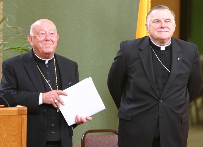 Archbishop-designate Thomas Wenski, currently bishop of Orlando and formerly a Miami priest and auxiliary bishop, stands next to Archbishop John C. Favalora, left, at the start of the press conference where it was announced that he had been named fourth archbishop of Miami.