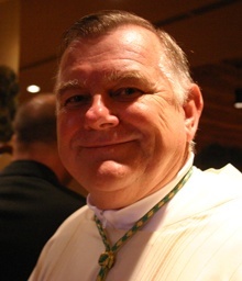 Miami's Archbishop-designate Thomas Wenski poses for the camera after celebrating Mass at St. Martha Church