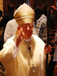 Archbishop John C. Favalora processes out of St. Martha Church after celebrating Mass on the day it was announced that Pope Benedict XVI had accepted his request to retire. Archbishop Favalora will turn 75 in December.