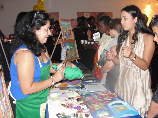 Vanessa Sanchez shows off one of the handmade crafts made by a women's cooperative in Haiti.