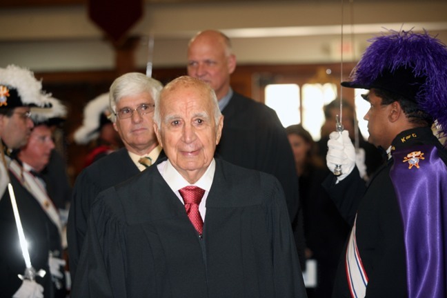 Chief U.S. Magistrate Peter R. Palermo walks between Knights of Columbus color guard during the April 28 Red Mass at Gesu Church. Behind him is Chief Judge Federico R. Moreno, both of the U.S. District Court, Southern District of Florida, and Federal Judge John O'Sullivan